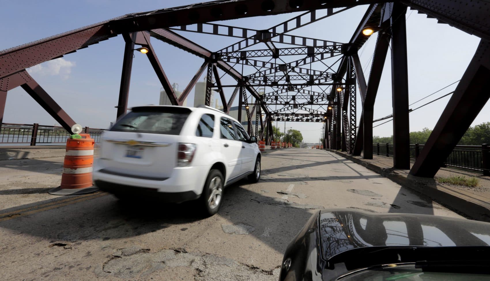 Vehicles drive on the 130th St. bridge over the Little Calumet River in Chicago in 2013. The bridge was classified as both &quot;structurally deficient&quot; and &quot;fracture critical&quot; in federal data for 2012. (M. Spencer Green/AP)