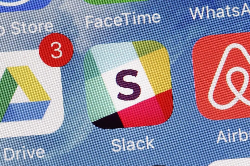 The Slack app is displayed on a mobile phone, Tuesday, Jan. 31, 2017, in New York. Slack Technologies is hoping to convert more big businesses to its online business messaging service by making it easier for workers in different departments to communicate with each other. (Mark Lennihan/AP)