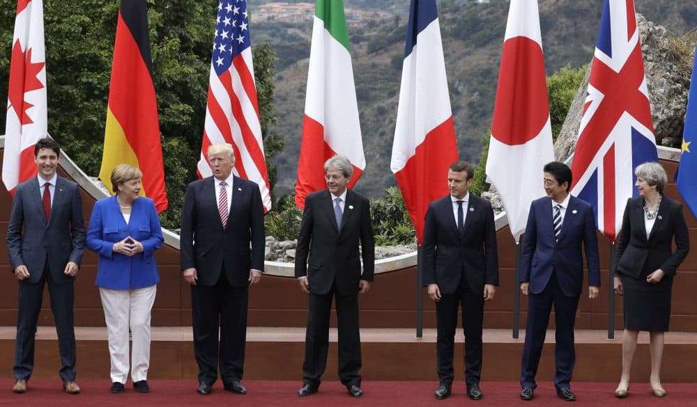 Leaders of the G-7, from left, Canadian Prime Minister Justin Trudeau, German Chancellor Angela Merkel, U.S. President Donald Trump, Italian Prime Minister Paolo Gentiloni, French President Emmanuel Macron, Japan's Prime Minister Shinzo Abe, and British Prime Minister Theresa May pose during a group photo for the G-7 summit in the Ancient Theatre of Taormina in the Sicilian citadel of Taormina, Italy, Friday, May 26, 2017. (Andrew Medichini/AP)