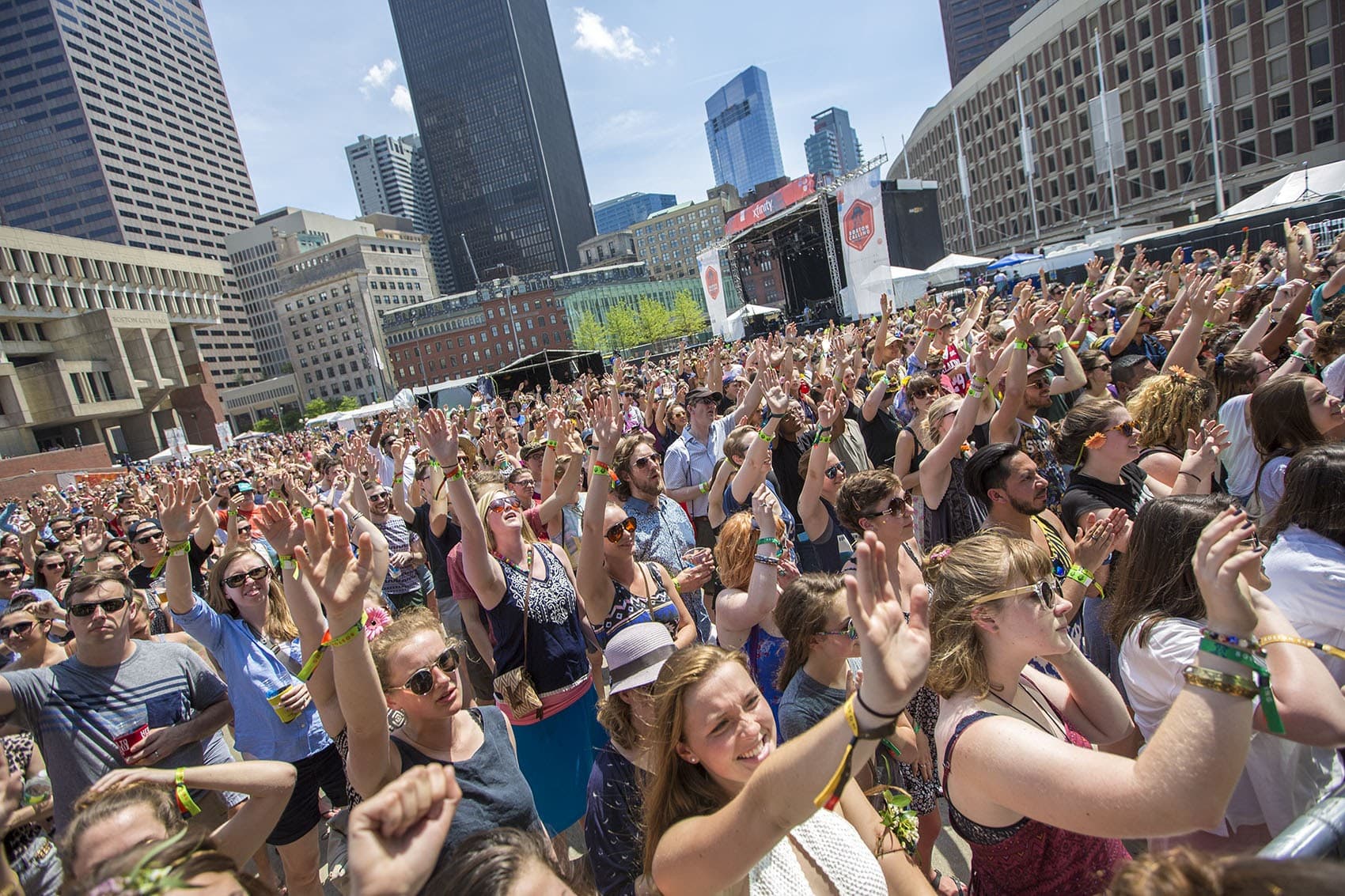 Fans cheer during Saturday afternoon concerts at Boston Calling in City Hall Plaza last May. This year, the festival is moving to greener pastures in Allston. (Jesse Costa/WBUR)