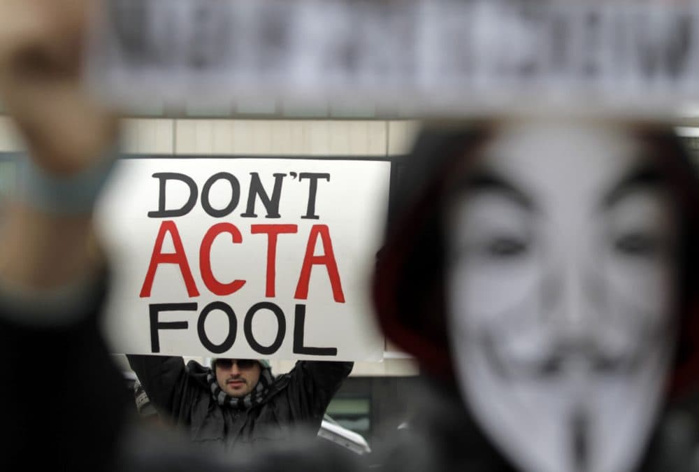 Protesters hold banners during a protest against the Anti-Counterfeiting Trade Agreement, or ACTA, in Sofia, Saturday, Feb. 11, 2012. Protesters gathered in several European cities Saturday to voice anger at an international copyright treaty that they fear will lead to censorship on the Internet. (Valentina Petrova/AP)
