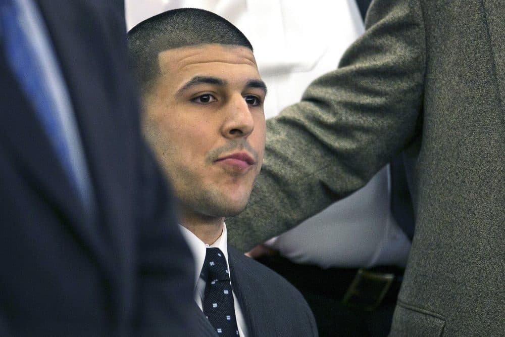 In this 2015 file photo, former New England Patriots football player Aaron Hernandez listens as the verdict is read finding him guilty in the shooting death of Odin Lloyd. (Dominick Reuter via AP pool)