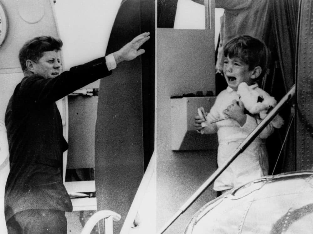 John F. Kennedy Jr. cries watching his father bid him farewell while boarding his jet for a flight to Arkansas on Oct. 3, 1963. (AP)