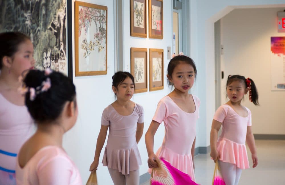 Young ballet dancers practice at the opening of the Pao Arts Center. (Max Larkin/WBUR)
