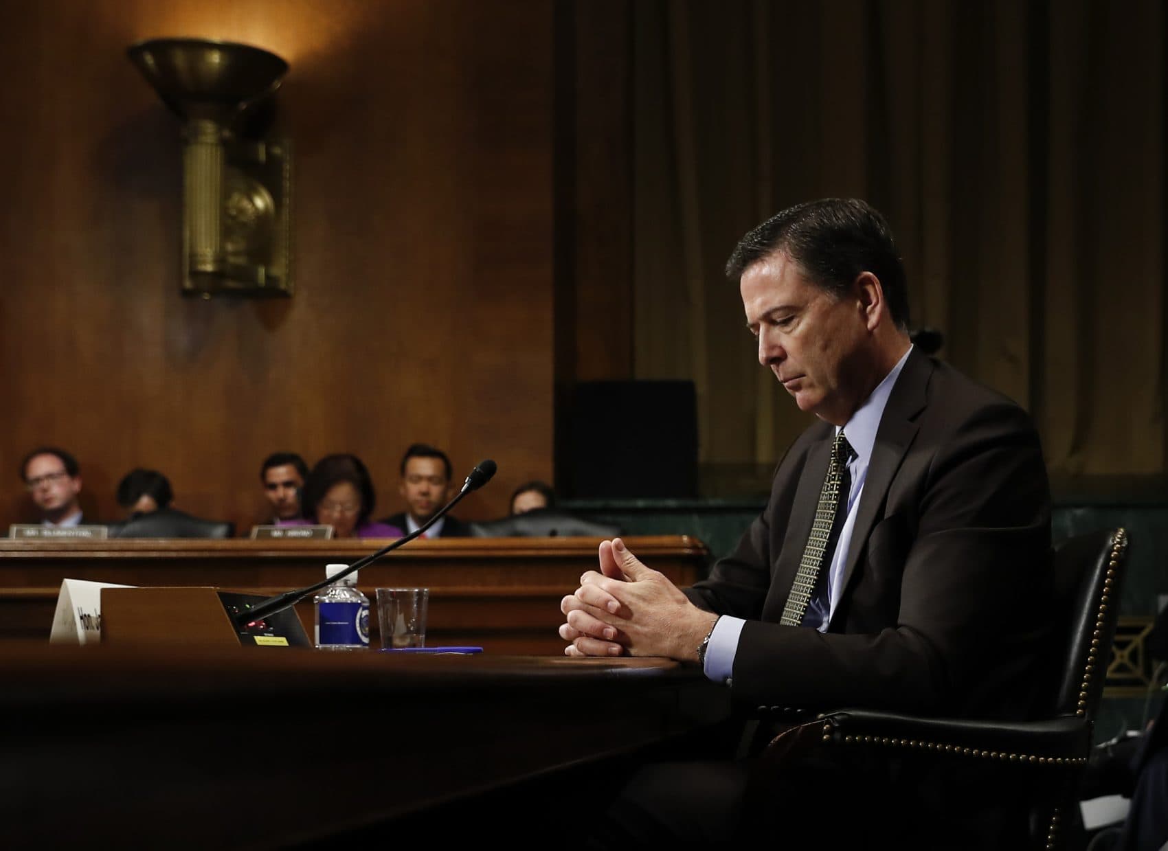 Congressional Republicans must confront whether they are willing to defend a corrupt president, or the institutions of American democracy, writes Steve Almond. Pictured: On Wednesday, May 3, 2017, then-FBI Director James Comey pauses as he testifies on Capitol Hill before a Senate Judiciary Committee hearing. President Donald Trump abruptly fired Comey on May 9. (Carolyn Kaster/AP)