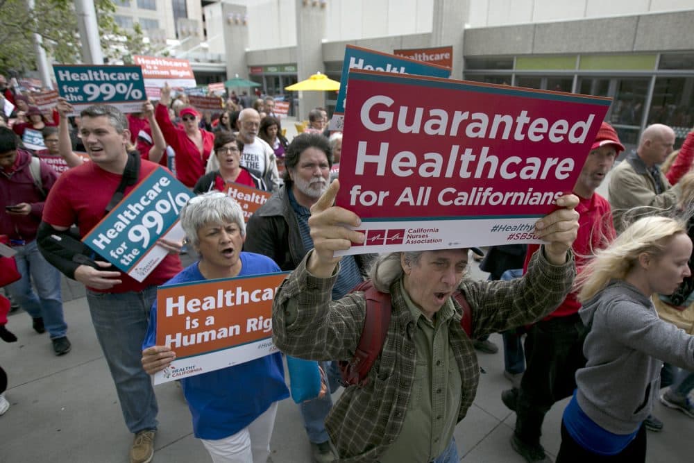 Supporters of single-payer health care march to the Capitol April 26, 2017, in Sacramento, California. (Rich Pedroncelli/AP)