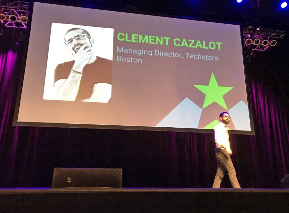 Clement Cazalot, the newly named managing director for Techstars Boston, speaks Wednesday during &quot;demo day&quot; for the accelerator's 2017 class. (Asma Khalid/WBUR)
