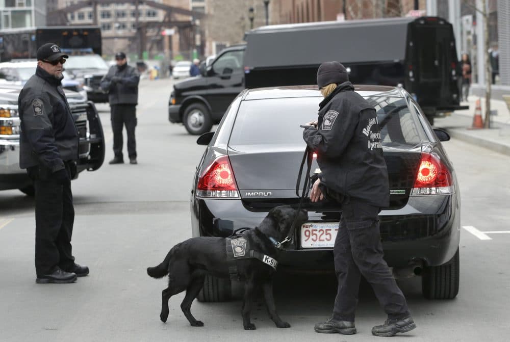 Boston Police Special Operations officers with a bomb-sniffing dog. (Steven Senne/AP)