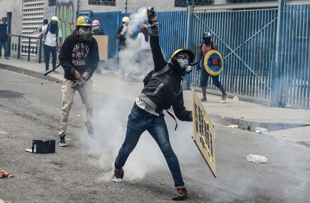 Opposition activists clash with riot police during a demonstration against President Nicolas Maduro's government in Caracas, on June 5, 2017. (Juan Barreto/AFP/Getty Images)