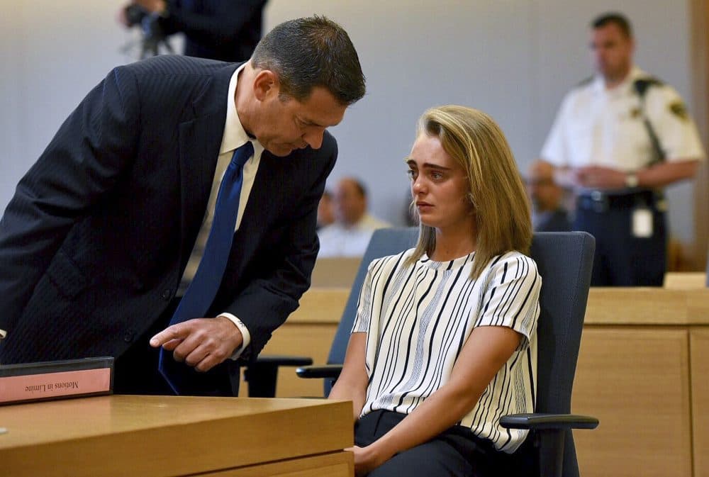Attorney Joseph Cataldo talks to his client, Michelle Carter, before meeting at a side bar at the beginning of the court session at Taunton Juvenile Court in Taunton on Monday. (Faith Ninivaggi/The Boston Herald via AP, Pool)