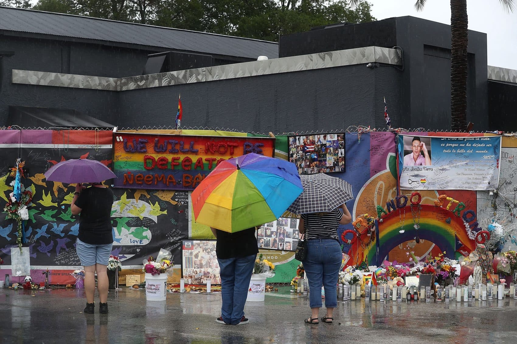 People visit the memorial to the victims of the Pulse nightclub shooting one day before the one-year anniversary of the shooting on June 11, 2017, in Orlando. (Joe Raedle/Getty Images)