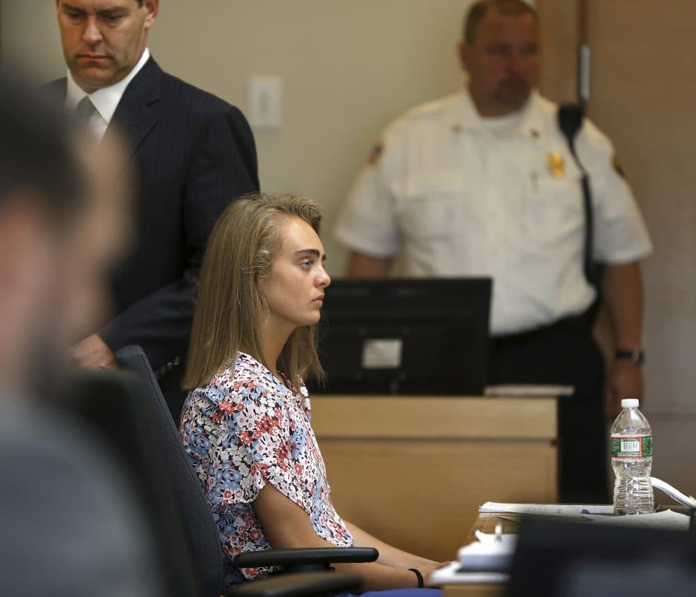 After a sidebar with Judge Lawrence Moniz (not seen) attorney Joe Cataldo, left, returns to the defense table, with his client Michelle Carter during her trial at Taunton Juvenile Court on Tuesday. (Pat Greenhouse/The Boston Globe via AP, pool)