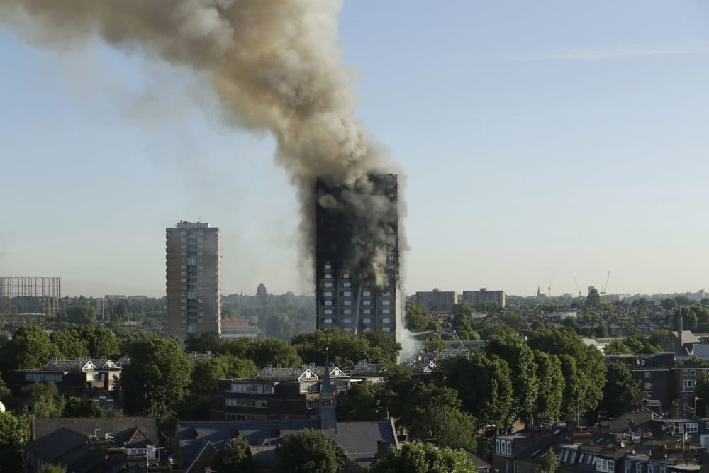 Smoke rises from a high-rise apartment building on fire in London, Wednesday, June 14, 2017. (Matt Dunham/AP)