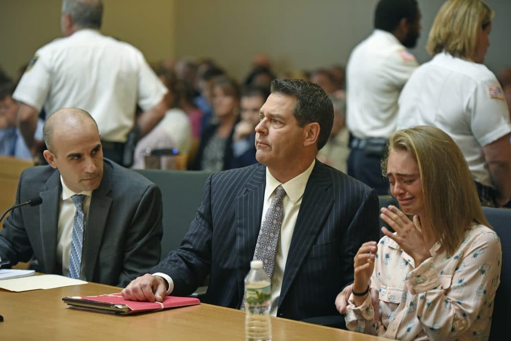 Michelle Carter, right, seated with her attorneys Cory Madera, left, and Joseph Cataldo reacts as she listens to Judge Lawrence Moniz before he finds her guilty Friday of involuntary manslaughter in the suicide of Conrad Roy III. (Glenn C.Silva/Fairhaven Neighborhood News, Pool)