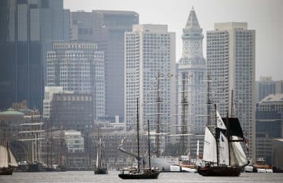 Tall ships pass in front of the skyline during Sail Boston's Parade of Sail, Saturday, June 17, 2017, in Boston. (AP Photo/Michael Dwyer)