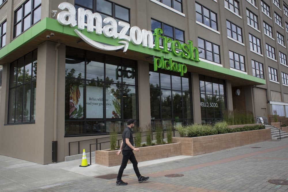 A man walks past an AmazonFresh Pickup location on June 16, 2017 in Seattle. Amazon announced that it will buy Whole Foods Market, Inc. for over $13 billion. (David Ryder/Getty Images)