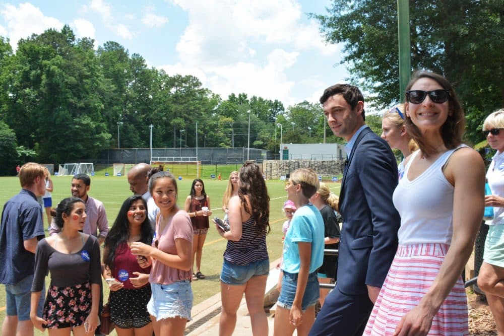 Democrat Jon Ossoff and his fiancée, Alisha Kramer, arrive at a &quot;Rock Your Ossoff!&quot; rally aimed at getting millennials to vote. (Sam Whitehead/GPB)
