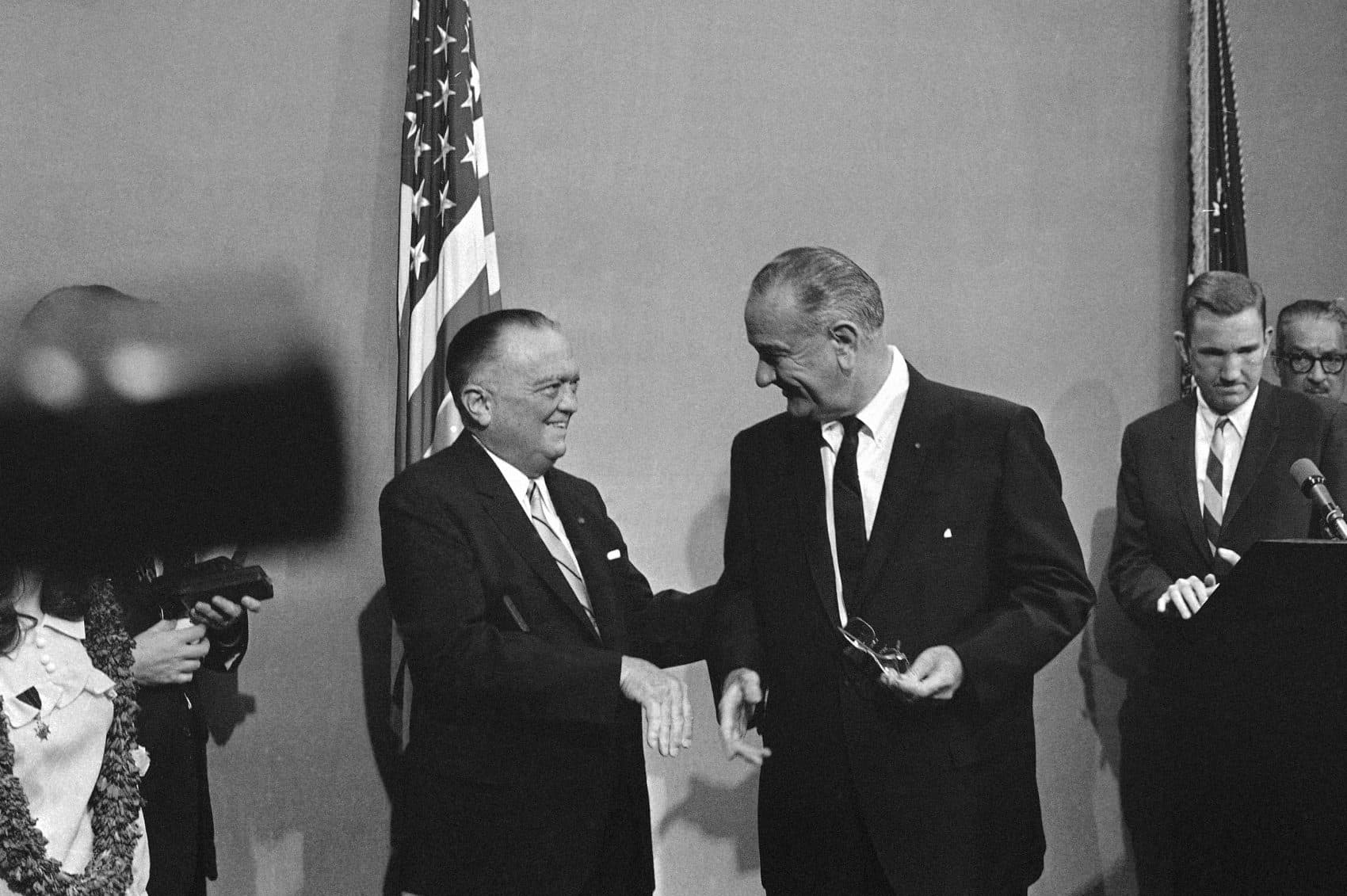 President Lyndon Johnson greets J. Edgar Hoover, FBI director (left) at the White House in Washington on June 21, 1967. (Henry Burroughs/AP)