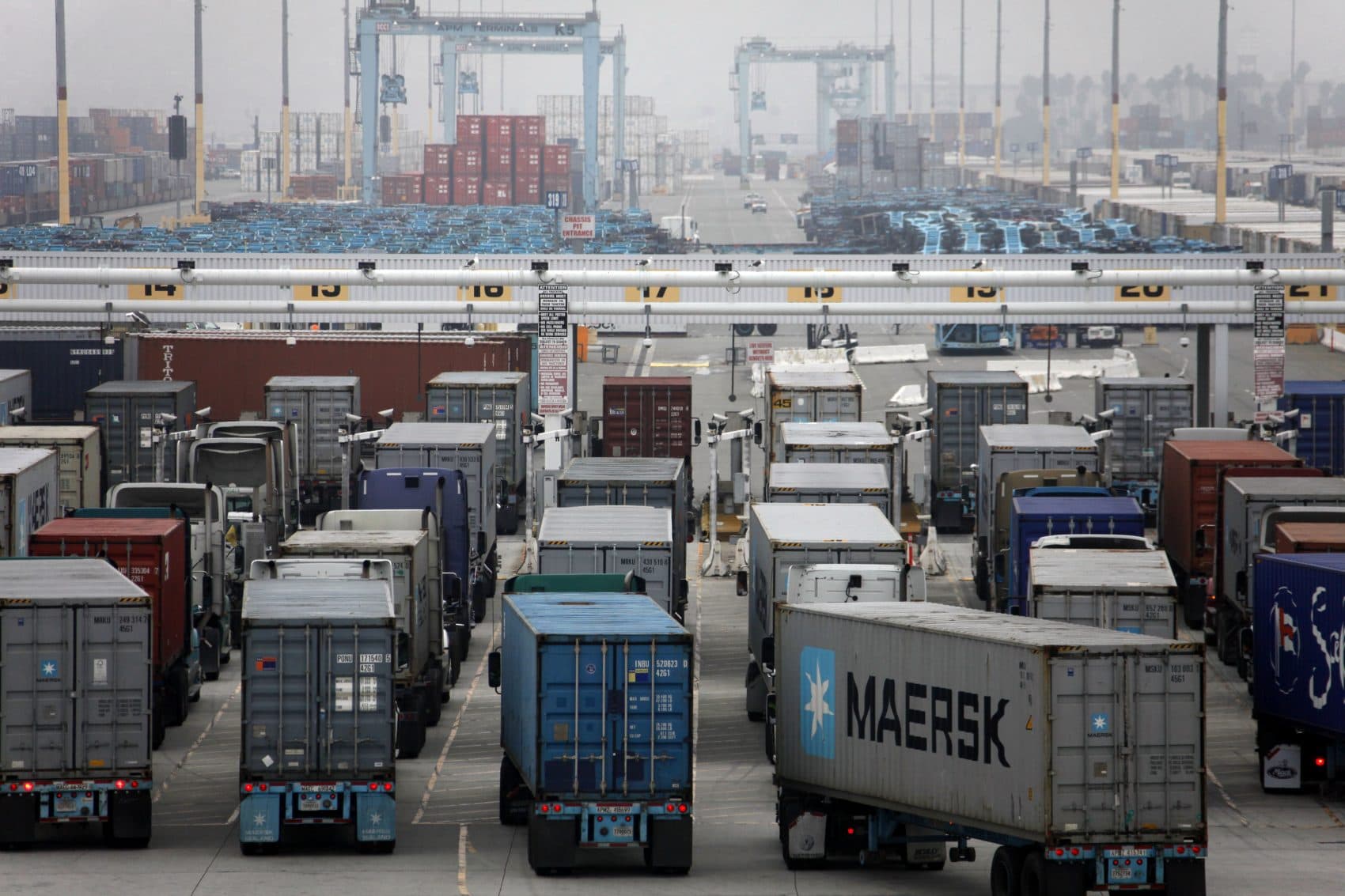 Trucks wait to be loaded at the Port of Los Angeles in 2012. (Nick Ut/AP)