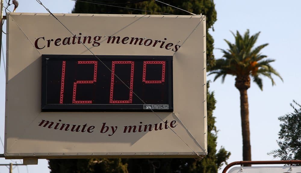 A local temperature sign reads 120-degrees as temperatures climb to near-record highs Tuesday, June 20, 2017, in Phoenix. (Ross D. Franklin/AP)