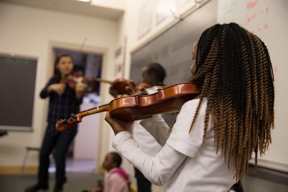 In Connecticut, an after-school arts program has partnered with a local resettlement agency to create a special violin class for young refugees. (Ryan Caron King/WNPR)