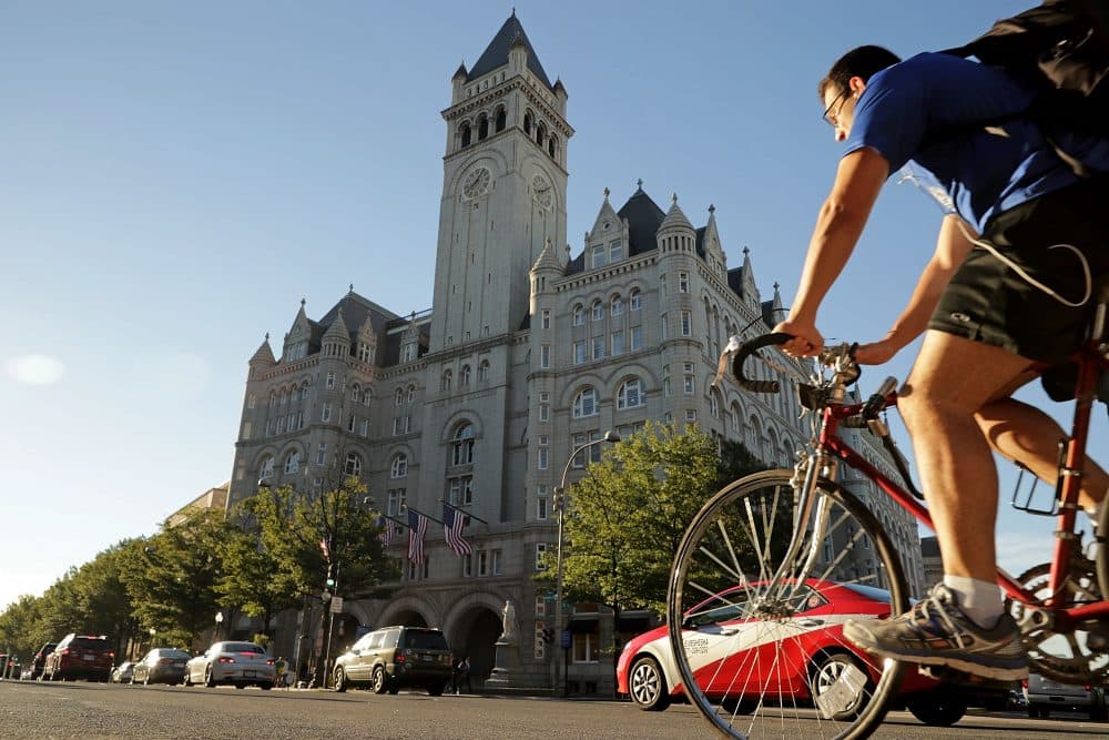 Morning traffic flows past the Trump International Hotel on its first day of business Sept. 12, 2016 in Washington. (Chip Somodevilla/Getty Images)