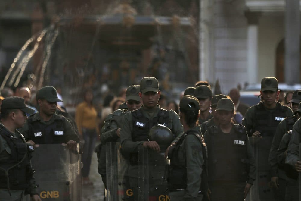 Venezuelan Bolivarian National Guard soldiers dressed in riot gear lineup inside of National Assembly building in Caracas, Venezuela, Tuesday, June 27, 2017. (Fernando Llano/AP)