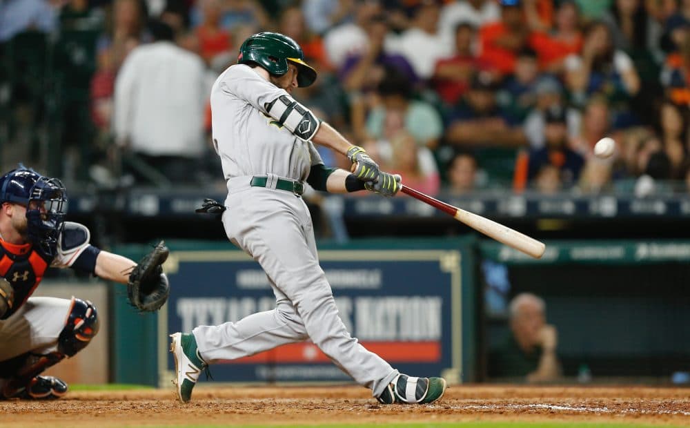 Jed Lowrie of the Oakland Athletics hits a home run in the seventh inning against the Houston Astros at Minute Maid Park on June 28, 2017 in Houston, Texas. (Bob Levey/Getty Images)