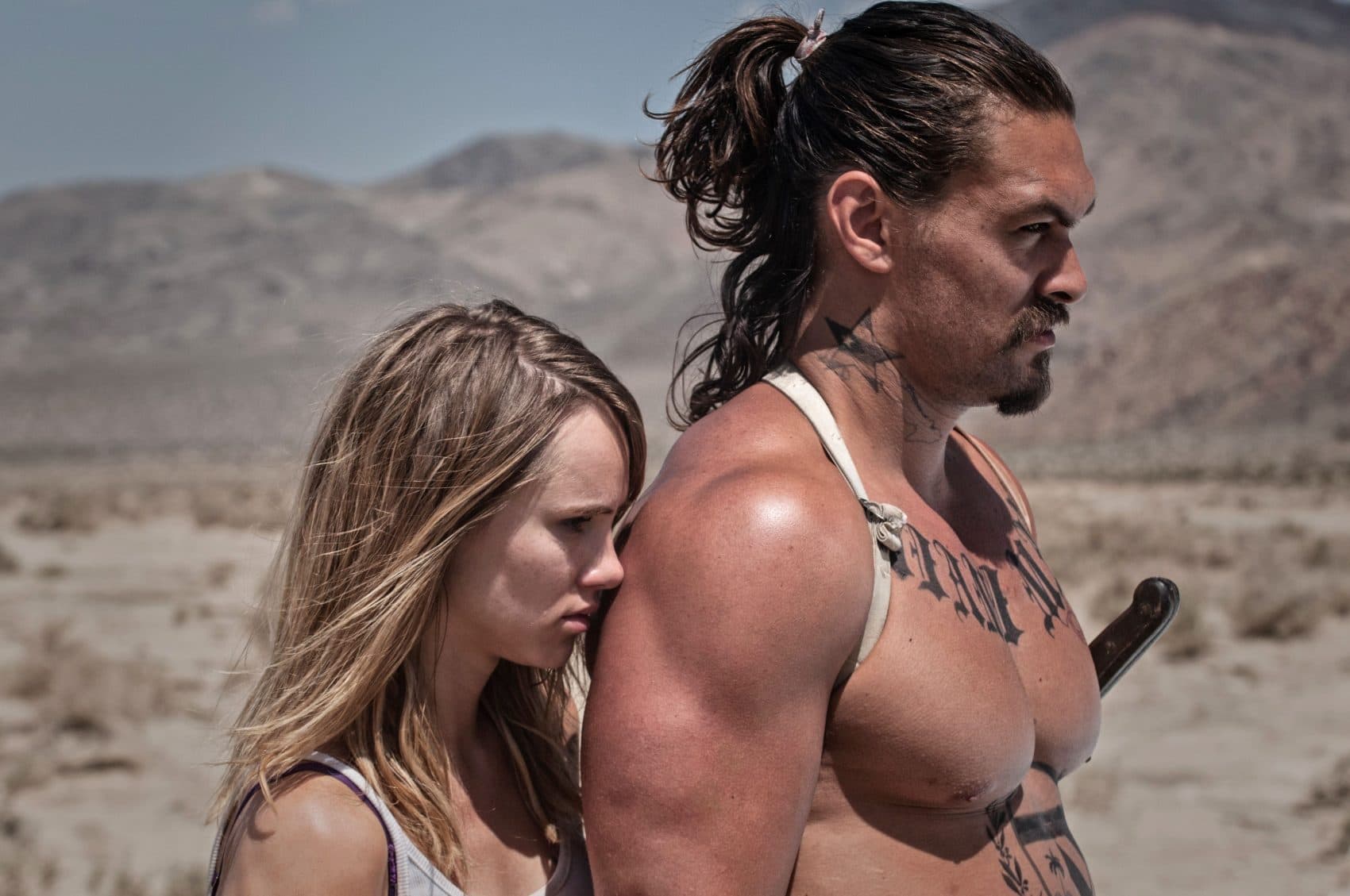 Arlen, played by Suki Waterhouse, and Miami Man, played by Jason Momoa, brace for a fight in &quot;The Bad Batch.&quot; (Courtesy NEON)