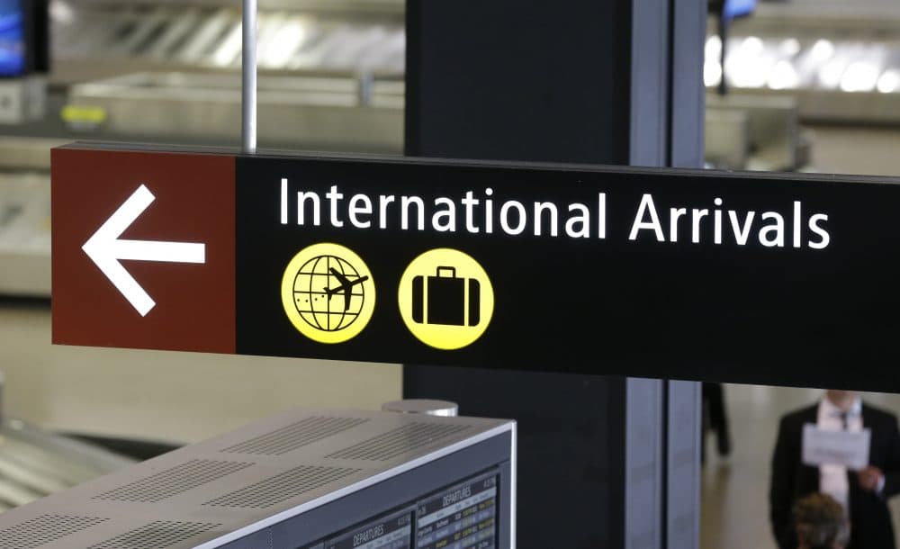 A sign for International Arrivals is shown at the Seattle-Tacoma International Airport. (Ted S. Warren/AP)
