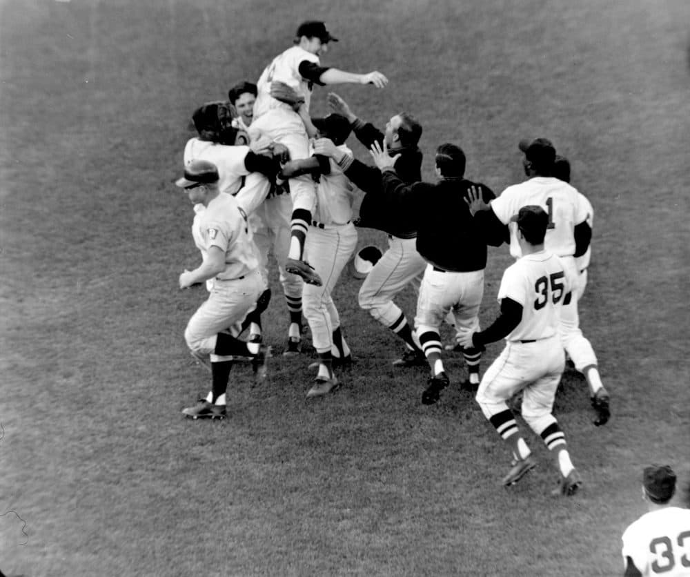 Boston Red Sox pitcher Jim Lonborg is lifted by his teammates following their 5-3 victory over the Minnesota Twins at Fenway Park in Boston on Oct. 2, 1967. (AP)