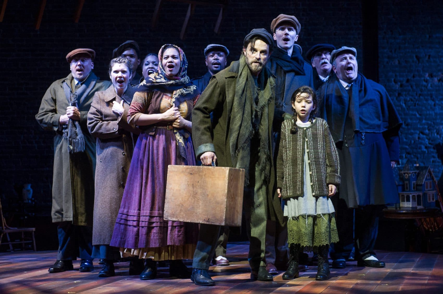 J. Anthony Crane (center) as Tateh and the cast of &quot;Ragtime.&quot; (Courtesy of Daniel Rader/Barrington Stage)