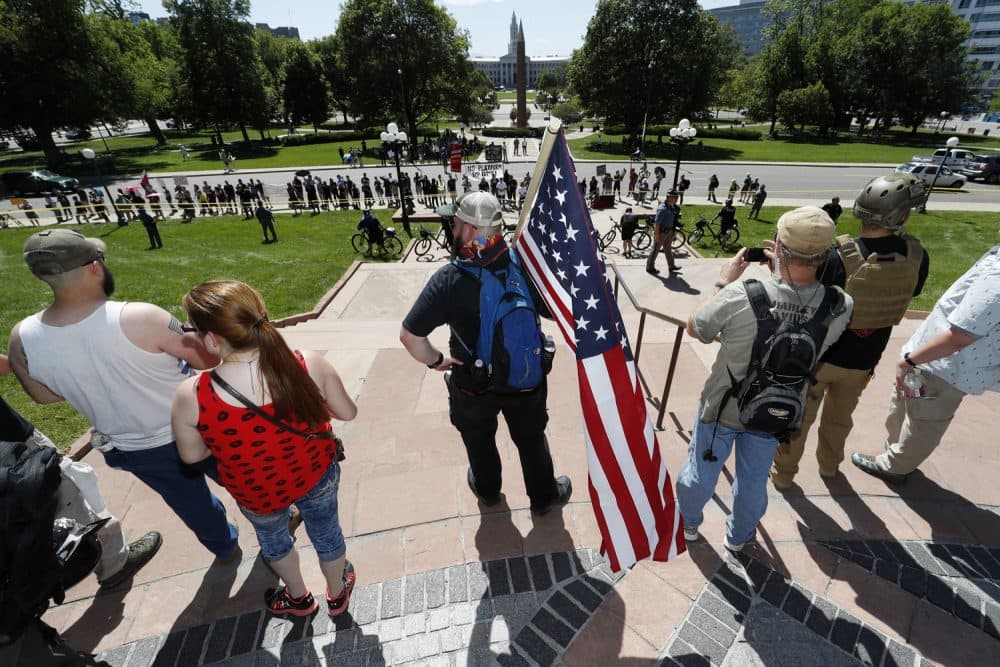 Protesters against Muslims wave American Flags during a &quot;March Against Sharia&quot; promoted by ACT for America! Saturday, June 10, 2017, on the grounds of the State Capitol in Denver. (David Zalubowski/AP)