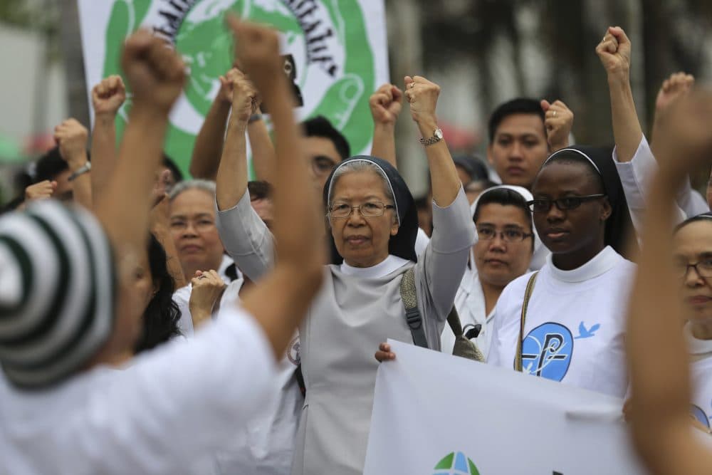 The ecological power of religion is ultimately more efficacious than the top-down power of government, writes Dan McKanan. Pictured: Filipino Catholic nuns join the Climate Solidarity Prayer March in Manila, Philippines Sunday, Nov. 29, 2015. (Aaron Favila/AP)