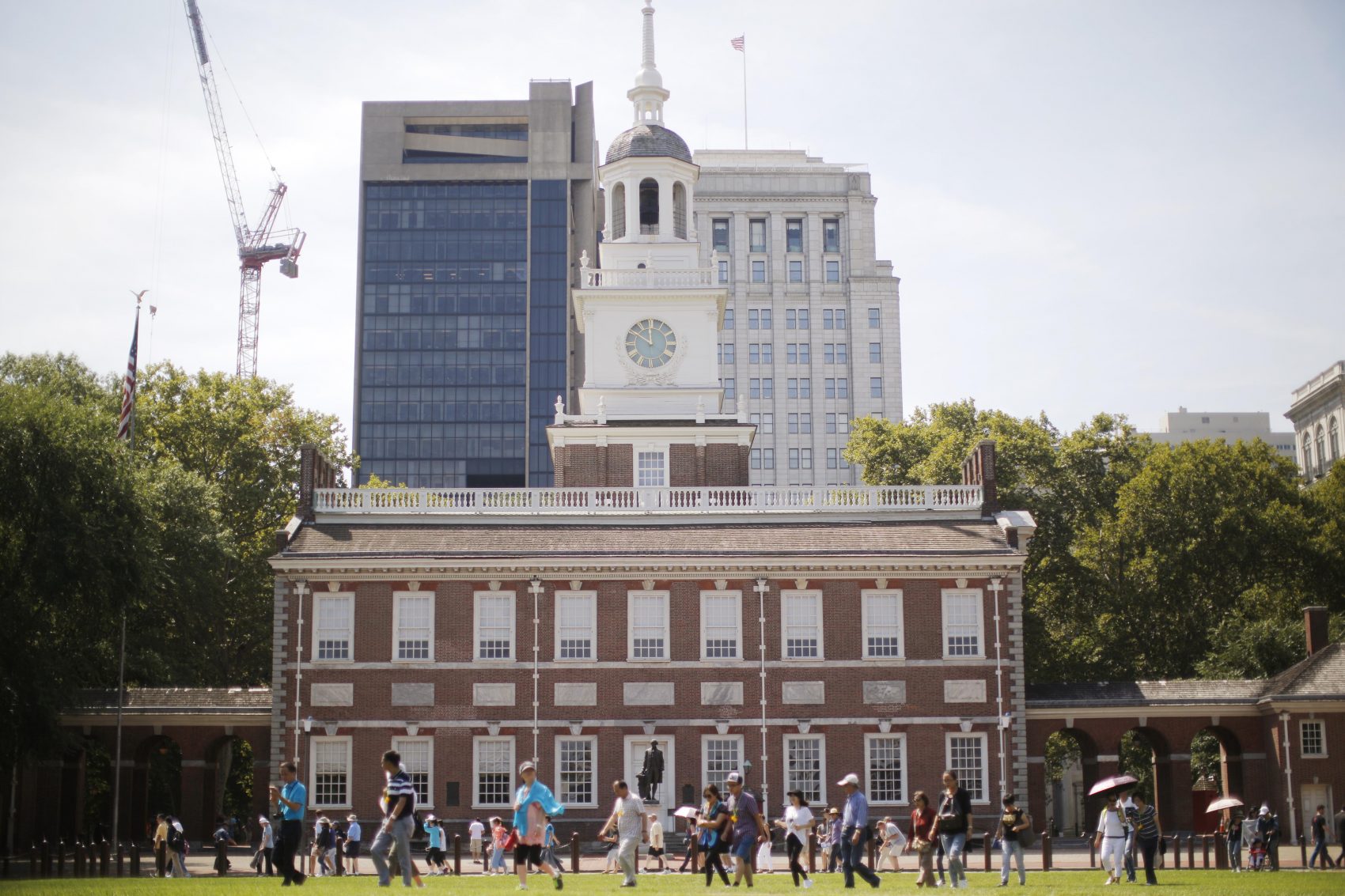 People move past Independence Hall at the Independence National Historical Park in Philadelphia, Thursday, Aug. 25, 2016. (Matt Rourke/AP)