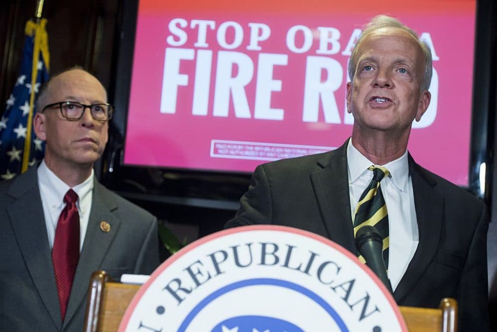 U.S. Representative Greg Walden (left) of Oregon and U.S. Senator Jerry Moran (right) of Kansas hold a press conference at Republican National Committee Headquarters in Washington, November 5, 2014. (Saul Loeb/AFP/Getty Images)