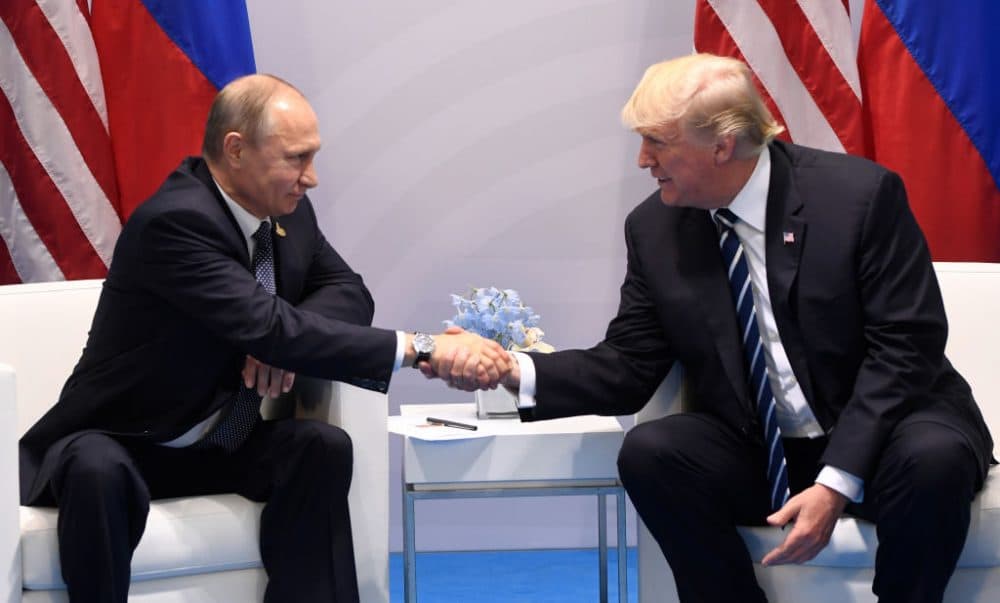 U.S. President Donald Trump and Russia's President Vladimir Putin shake hands during a meeting on the sidelines of the G-20 Summit in Hamburg, Germany, on July 7, 2017. (Saul Loeb/AFP/Getty Images)