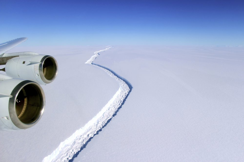 This Nov. 10, 2016 aerial photo released by NASA, shows a rift in the Antarctic Peninsula's Larsen C ice shelf. A vast iceberg with twice the volume of Lake Erie has broken off from a key floating ice shelf in Antarctica, scientists said Wednesday July 12, 2017 . The iceberg broke off from the Larsen C ice shelf, scientists at the University of Swansea in Britain said. The iceberg, which is likely to be named A68, is described as weighing 1 trillion tons (1.12 trillion U.S. tons). (John Sonntag/NASA via AP)