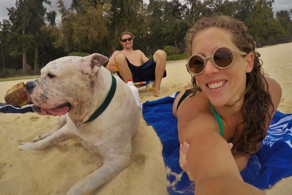 Mary Finley, Travis Sherman and Tonka at the beach. &quot;I'm fearful of the world that we are making for ourselves,&quot; Travis said. &quot;That's why I don't want to have children.&quot; (Courtesy Mary Finley)