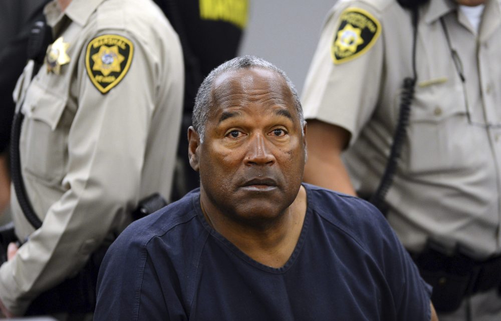 In this May 14, 2013 pool file photo, O.J. Simpson sits during a break on the second day of an evidentiary hearing in Clark County District Court in Las Vegas. Simpson, the former football star, TV pitchman and now Nevada prison inmate, will have a lot going for him when he appears before state parole board members Thursday, July 20, 2017 seeking his release after more than eight years for an ill-fated bid to retrieve sports memorabilia. (Ethan Miller, Pool/AP)