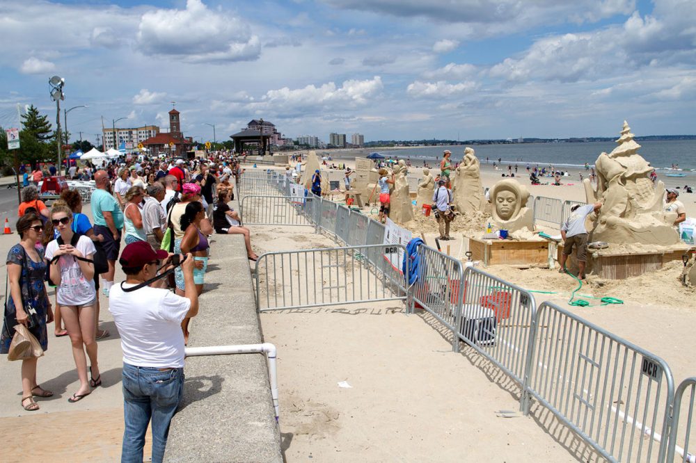 Spectators take in the Revere Beach Sand Sculpting Festival in 2015. (Hadley Green for WBUR)
