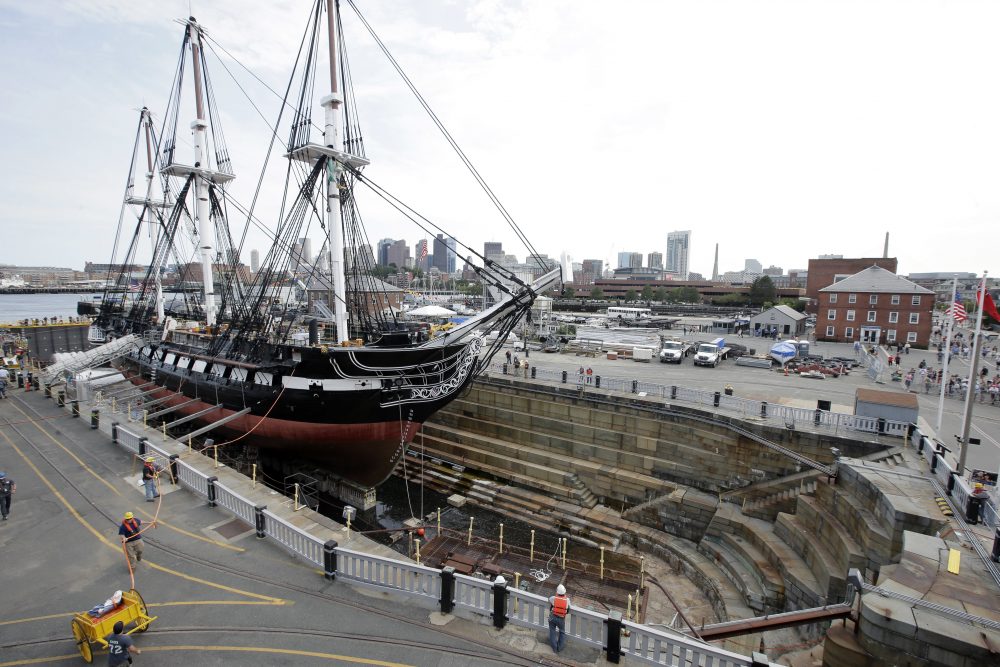 The USS Constitution, also known as Old Ironsides, rests in dry dock as water enters the basin to refloat the vessel on Sunday at Charlestown Navy Yard in Boston. (Steven Senne/AP)