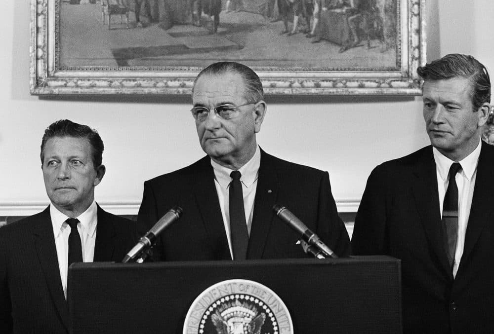 President Lyndon Johnson speaks to members of his advisory commission on civil disorders at the group's first meeting on July 29, 1967 at the White House, Washington. Otto Kerner, left, of Illinois, the chairman of the group and Mayor John Lindsay of New York (right) vice chairman. (AP Photo/WX)