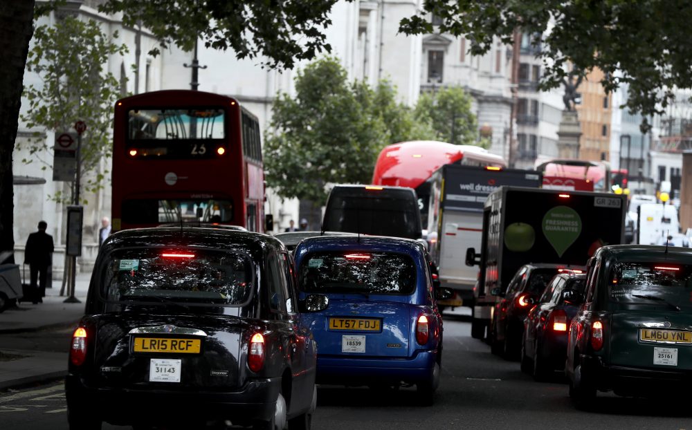 Vehicles drive in central London, Wednesday, July 26, 2017. Britain is pledging to ban the sale of new gas- and diesel-powered cars by 2040. (Kirsty Wigglesworth/AP)