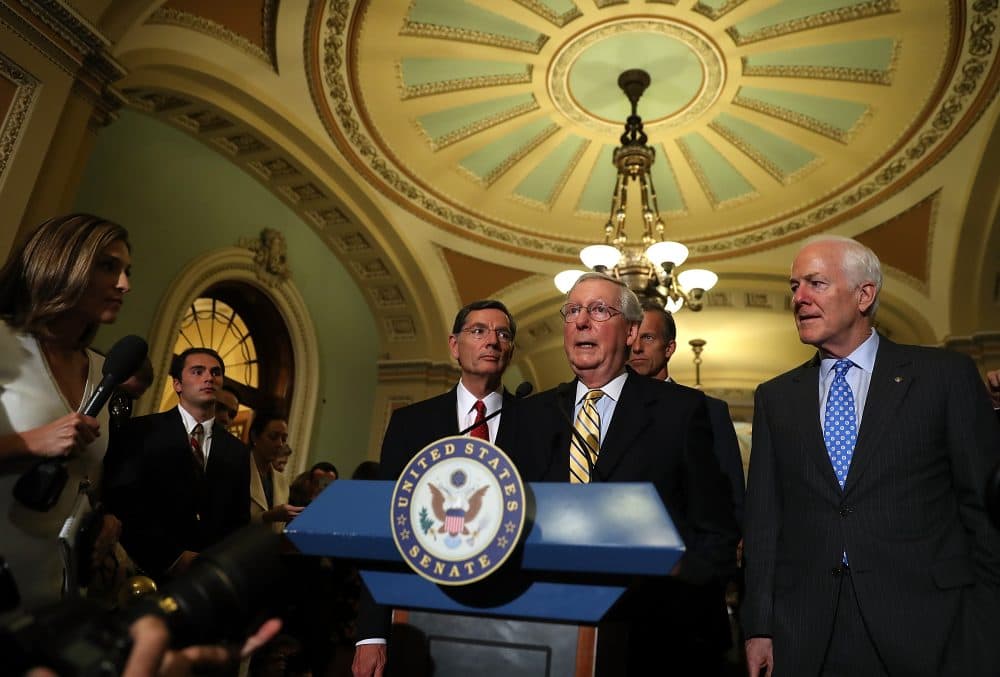 (Left to right) U.S. Sen. John Barrasso (R-Wyo.), Senate Majority Leader Mitch McConnell (R-Ky.), U.S. Sen. John Thune (R-S.D.) and U.S. Sen. John Cornyn (R-Texas) speak to reporters during a news conference on Capitol Hill following a procedural vote on the GOP health care bill on July 25, 2017 in Washington. (Justin Sullivan/Getty Images)