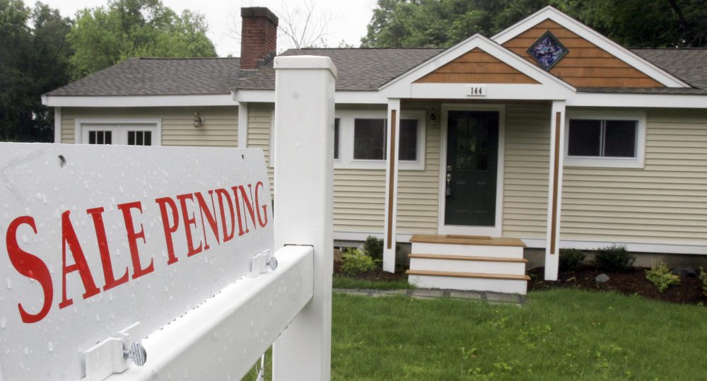 A sign announces a residential home sale is pending in Framingham. (Bill Sikes/AP File)