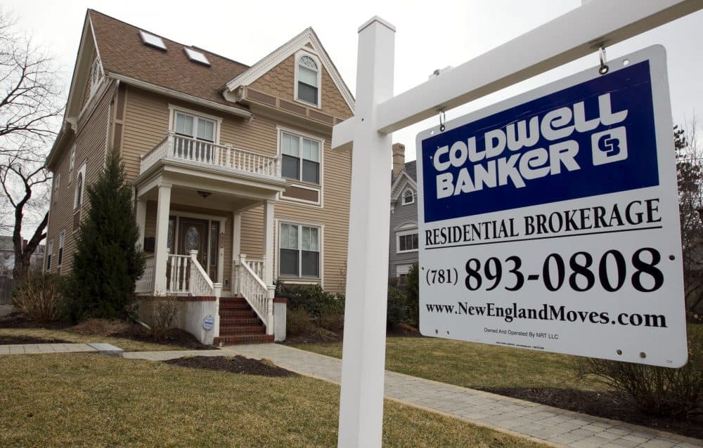 This March 15, 2012 file photo shows a home with a real estate sign in front in Watertown, Mass. (Steven Senne/AP/File)