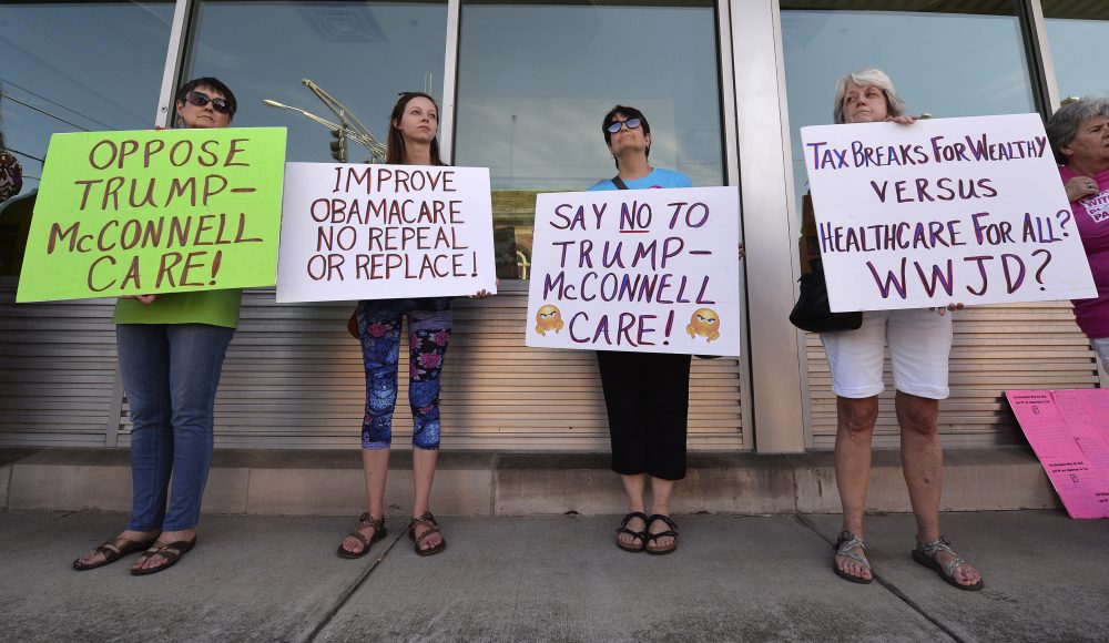 Protesters wait for the arrival of Senate Majority Leader Mitch McConnell, R-Ky., at the Hardin County Lincoln Day Dinner, Friday, June 30, 2017, in Elizabethtown, Ky. Congressional Republicans are stymied over health care. But after seven years of promising to repeal and replace former President Barack Obama’s law, they risk political disaster if they don’t deliver. (Timothy D. Easley/ AP)
