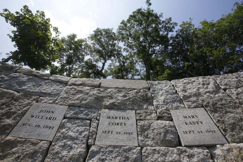 Proctor’s Ledge was identified last year as an execution site for those convicted during the Salem witch trials in 1692. On Wednesday, a new memorial at the site was dedicated in honor of those killed. (Stephan Savoia/AP)