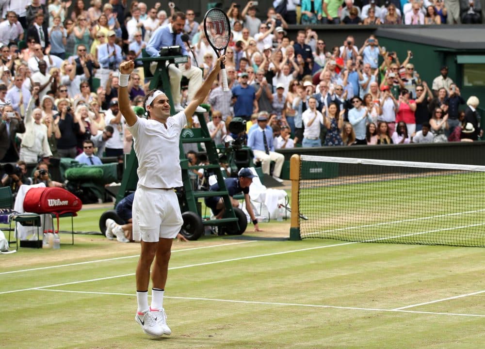Roger Federer jumps for joy after winning his 8th Men's Singles title at Wimbledon. (Julian Finney/Getty Images)